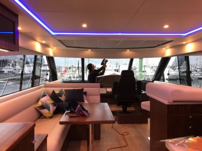 Yacht window tinting in process inside with lights on